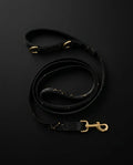 DSS Black and Gold Splatter — First 100 Leash, flat-lay